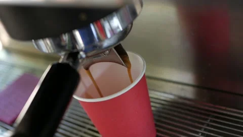 Coffee machine pouring coffee in to the paper cup. Stock Footage 138563817