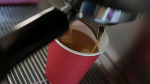 Coffee machine pouring coffee in to the paper cup. Video stock 138564455