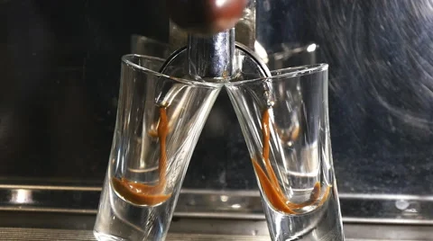 Coffee machine pouring espresso into the cup in slowmotion Stock Footage 60229368