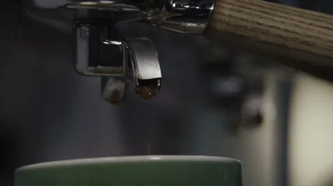 Coffee machine pouring espresso in cup 库存影片 60672799
