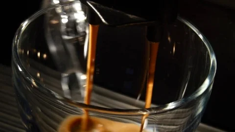 Coffee machine pouring espresso in cup extremely close-up Stock Footage 74270390