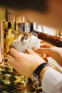 Coffee Machine Pouring Espresso into Plastic Cups Stock Photos