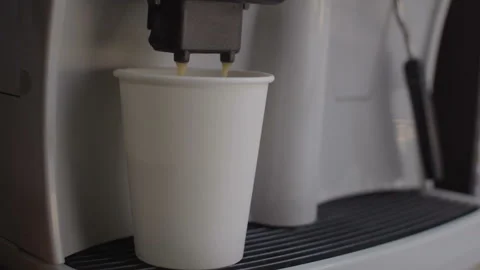 The coffee machine pours the coffee into a disposable cup. Vídeo Stock 94828837