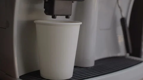 The coffee machine pours the coffee into a disposable cup. 스톡 동영상 94828934