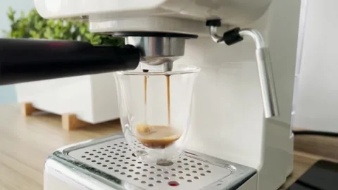 The coffee machine pours coffee into a mug Stock Footage 167949082