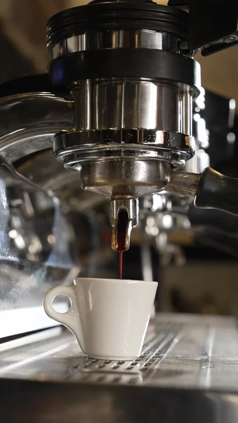 A coffee machine pours coffee into a mug Stock Footage 220066956
