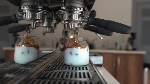Coffee Machine Prepares And Pours Espresso Coffee Into Glass Cup With Milk Video Stock Footage 252643054