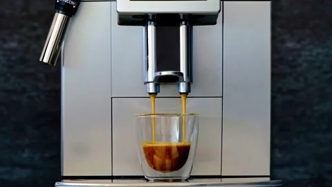 Coffee machine prepares coffee. Coffeemaker three cups. 4K Stock Footage 154792433