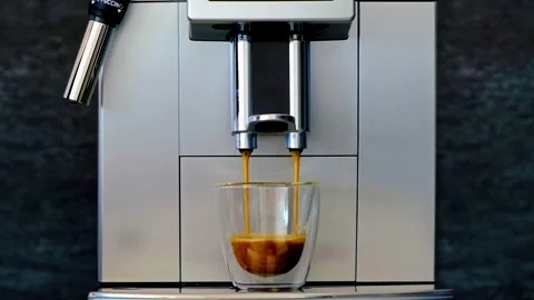 Coffee machine prepares coffee. Coffeemaker three cups. 4K Stock Footage 154792449