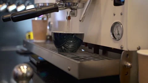 Coffee machine prepares coffee in cup on background of kitchen. Stock Footage 147014730