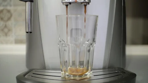 Coffee machine prepares coffee into a glass Stock Footage 98808707