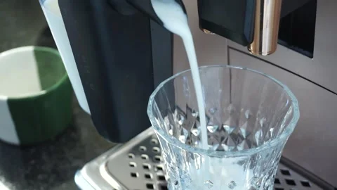 Coffee Machine that prepares frothy milk for coffee. Video stock 257598771