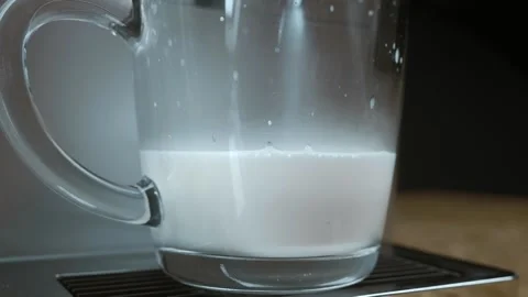 The coffee machine prepares an invigorating morning cappuccino Stock Footage 259863223