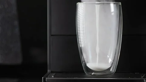 Coffee machine preparing and dispensing frothed milk Stock-Footage 171921348