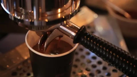 The coffee machine is in the process of making hot coffee 스톡 동영상 293167733