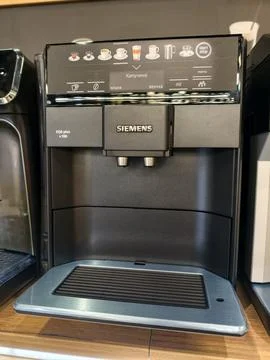 Coffee machine of Siemens brand located on shelf in household appliance cen.. Stock Photos