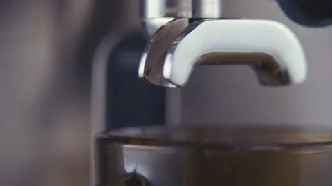 The coffee machine starts pouring Coffee into Cup. Slow motion. Video stock 90226740
