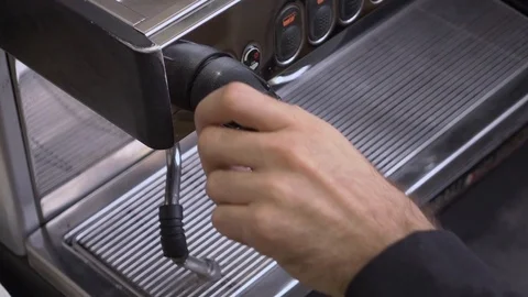 Coffee machine in steam, barista preparing coffee at cafe. Stockbeeldmateriaal 116959357