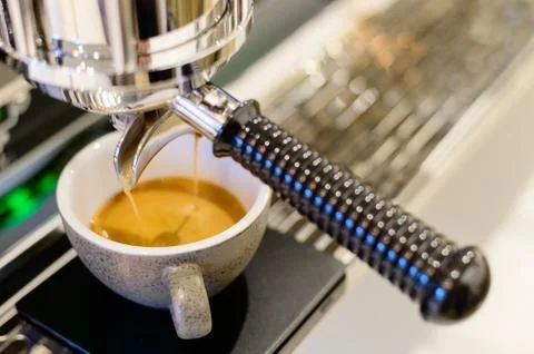 Coffee machine with stream coffee pouring in the cup Foto stock