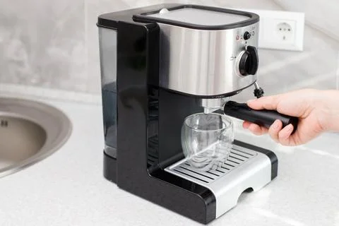 Coffee machine on the table in the kitchen at home Foto stock