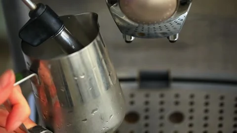 Coffee machine working heating and steaming the milk making foam for cappuccino. Stock Footage 142659887