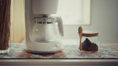 Coffee Maker and Jar with Spoon on Kitchen Counter Stock Footage 318411031