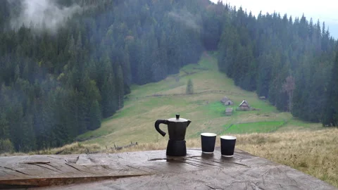 Coffee maker and mug on the table Stock Footage 142434836