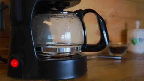 Coffee maker with boiling and dripping sound starting to make coffee. Stock Footage 266862578