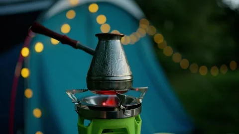 Coffee Maker Boiling On Portable Camping Gas Burner Beside Tent Stock Footage 347974777
