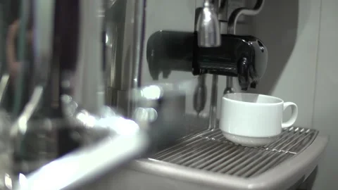 A coffee maker brews a cup of black coffee. Stock Footage 286345571