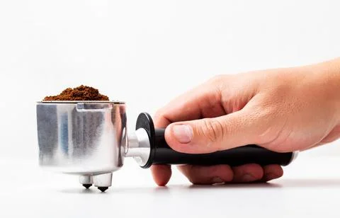 Coffee maker horn in hand on white background, close-up, isolated Photos