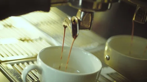 Coffee maker machine fills cup in slowmotion - shot on Arri Alexa 4K Stock Footage 103849224