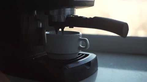Coffee maker makes espresso in a white cup. Barista makes cappuccino or espresso Stock Footage 201291723