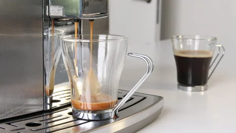 Coffee maker making a coffee in a transparent cup. Stock Footage 196219907