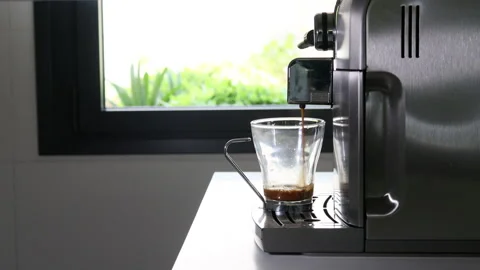 Coffee maker making an expresso coffee in a kitchen. Stock Footage 196220070