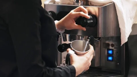 Coffee maker preparing hot milk foam Stock Footage 73961012