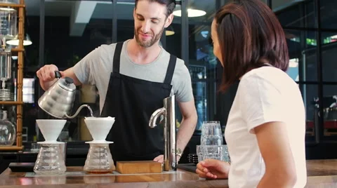 Coffee making demonstration in cafe Stock Footage 58127374