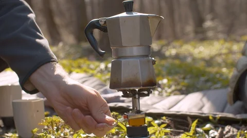 Coffee making in the forest on burner Stock Footage 129074534