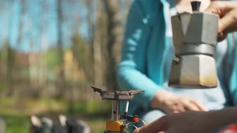 Coffee making in the forest on burner Stock Footage 131389783
