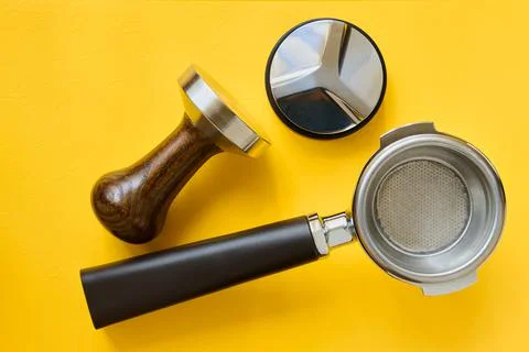 Coffee making tools, coffee basket holder, flattening and tamper Stock Photos