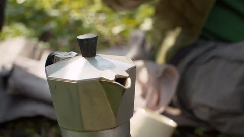 Coffee making in the woods on fire Stock Footage 128876206