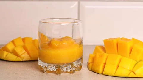 Coffee with mango in a glass. Exotic cold coffee. Stock Footage 243177464