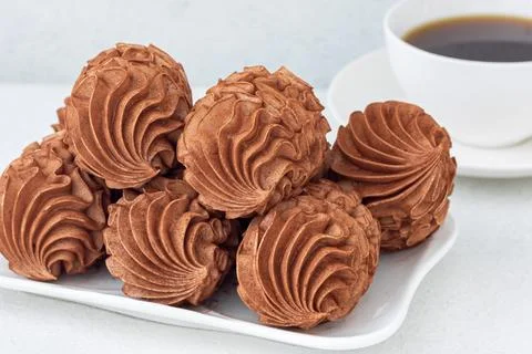 Coffee marshmallows for breakfast with a cup of fragrant coffee Stock Photos