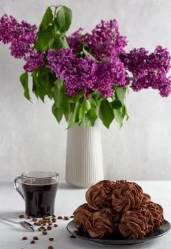 Coffee marshmallows on a light background in a plate, in the background - a c Stock Photos
