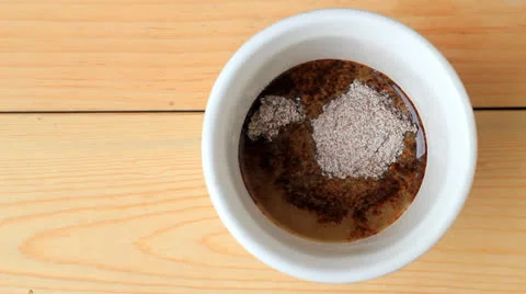 Coffee melt in cup, wood pattern background. Stock Footage 27094437