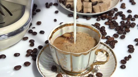 Coffee with milk. Adding milk to coffee.  Slow motion 240 fps. Stock-Footage 55821775