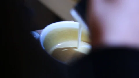 Coffee - milk effect/Milk effect on coffee or cappuccino surface Stock Footage 100143886