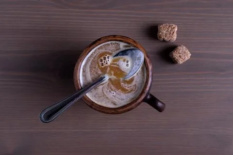 Coffee with milk in a fired earthenware mug Stock Photos