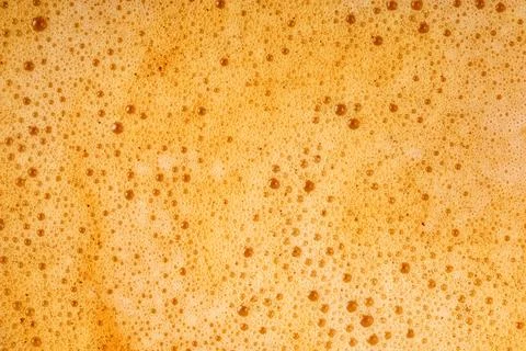 Coffee milk foam. Background texture of cappuccino, closeup. Macro. Stock Photos