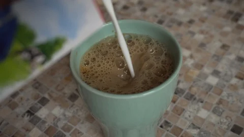 Coffee with milk in the kitchen Stock Footage 127839673